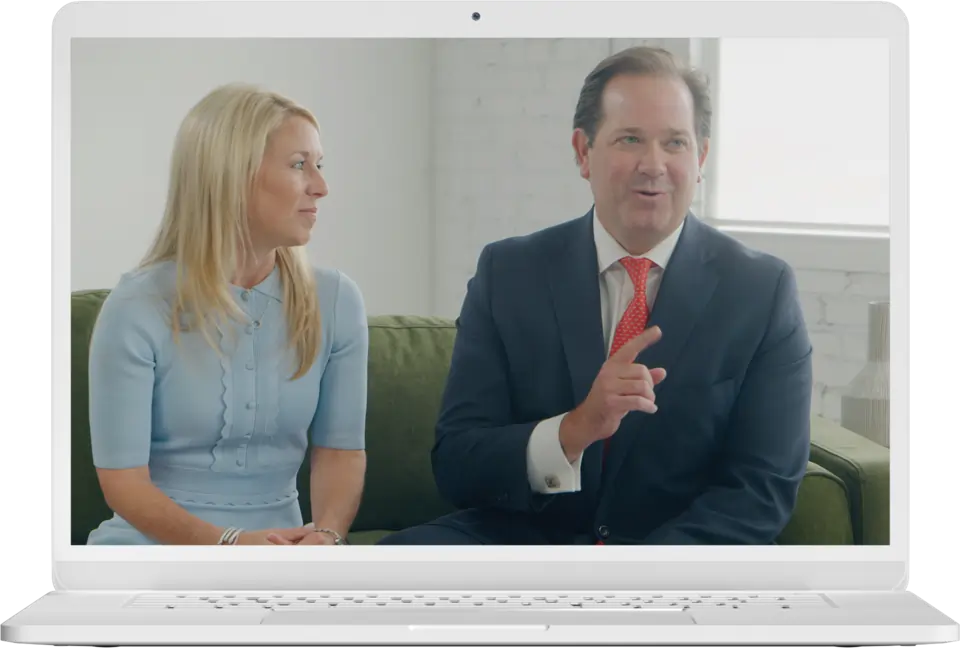 A man and a woman sitting on a couch telling a story